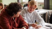 Two high school students working together in math class