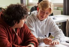 Two high school students working together in math class