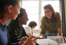 High school math teacher working with students