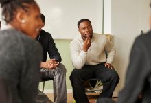 High school teacher leads a student group discussion