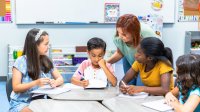 A small group of elementary students working together