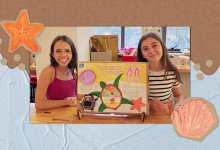 Two students with their project on saving sea animals
