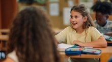 Elementary student asking questions in class
