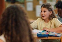Elementary student asking questions in class