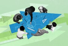 Administrators and school staff having a meeting around an arrow-shaped blueprint