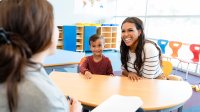 Preschool teacher meeting with a parent