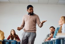 A teacher modeling a lesson method to other teachers