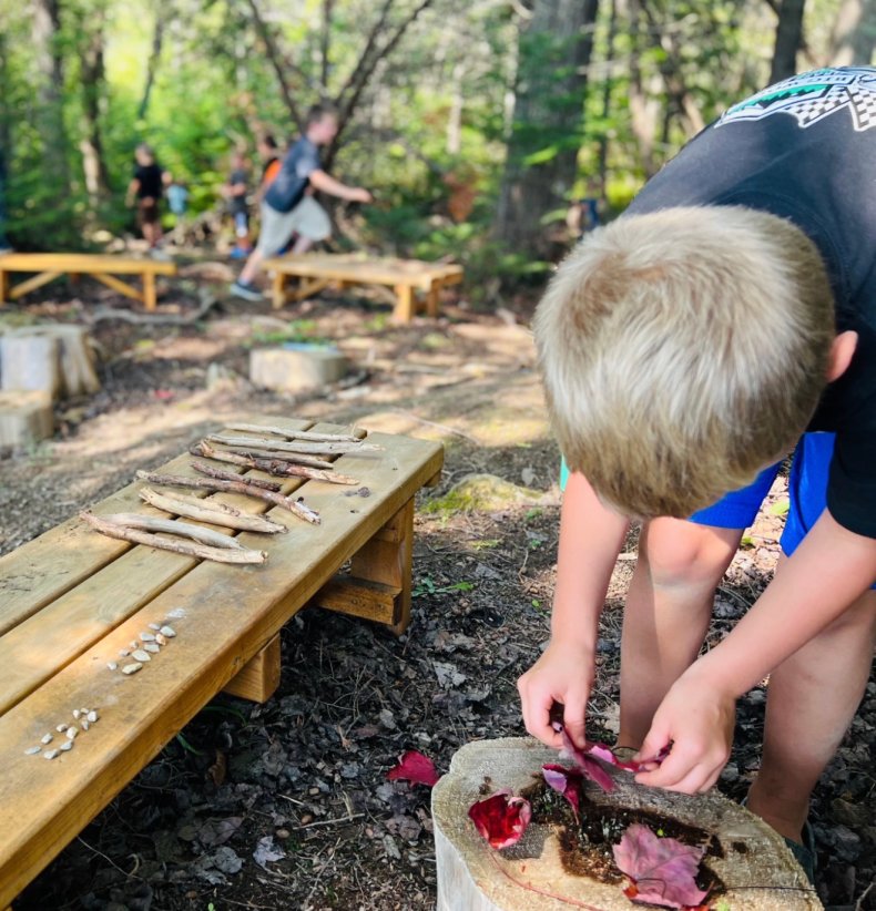 Elementary student working on a fall outdoor project