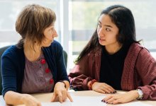 Teacher and student talking one-on-one
