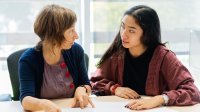 Teacher and student talking one-on-one