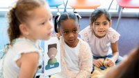 Elementary students working with emotion flashcards