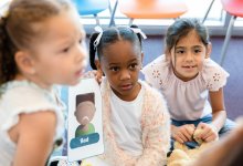Elementary students working with emotion flashcards