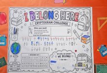 Hallway bulletin board decorated with a cryptogram puzzle