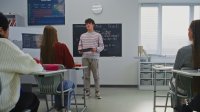High school student giving a presentation to the class