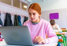 A student focused while working on their laptop