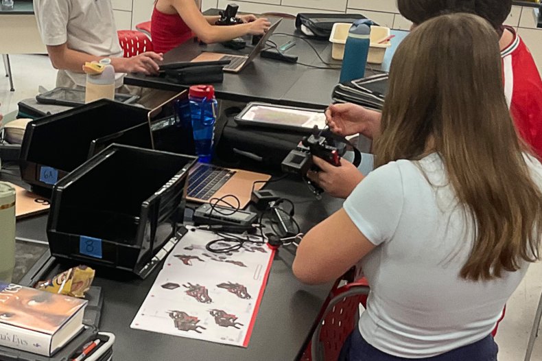 Middle school students building a car